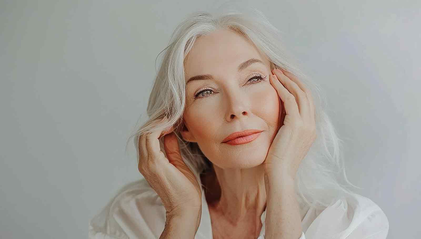 mature woman with her hands to her face