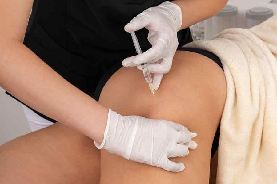 woman reieving a vitamin B12 injection in her hip